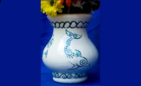Dolphin decorated ceramic vase